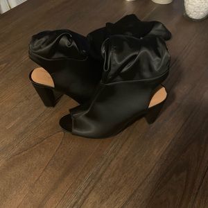 Thigh high open toe shoe.